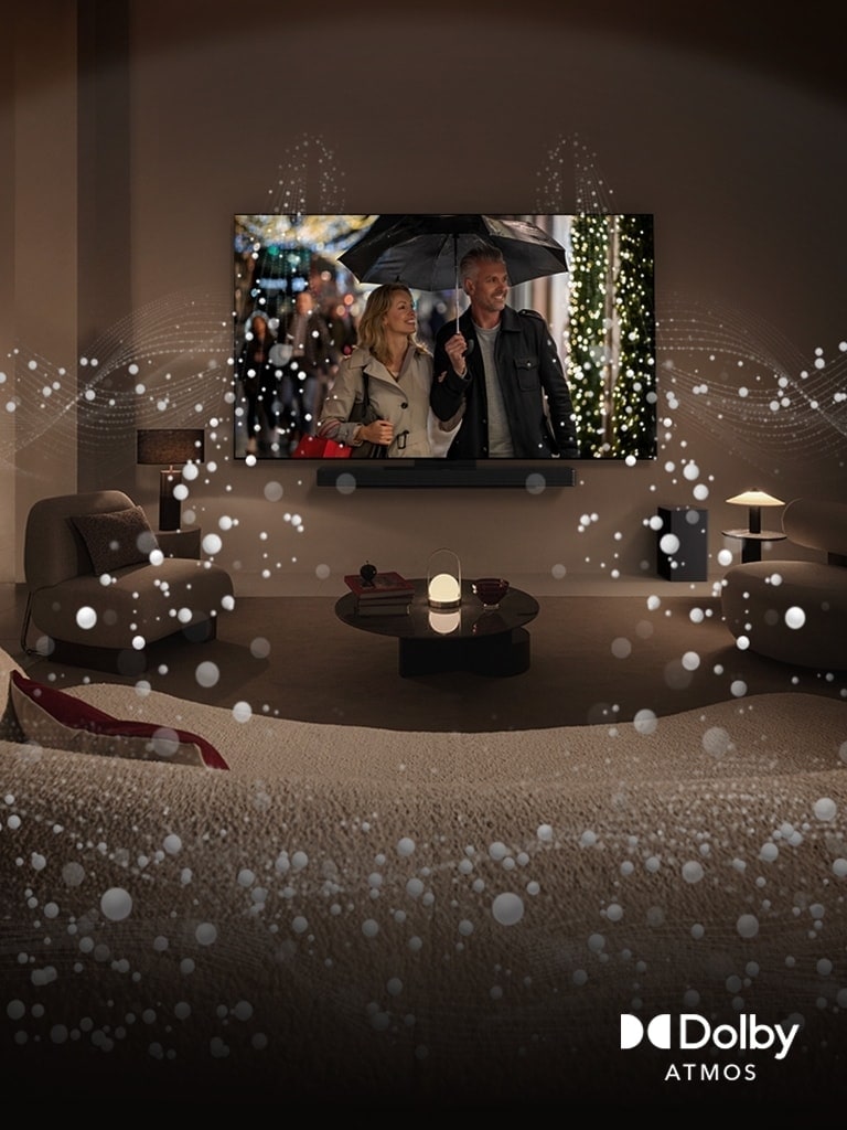 A cozy, dimly lit living space, LG OLED TV displaying a couple is using an umbrella, and bright circle graphics surround the room. Dolby Atoms logo in the bottom left corner.