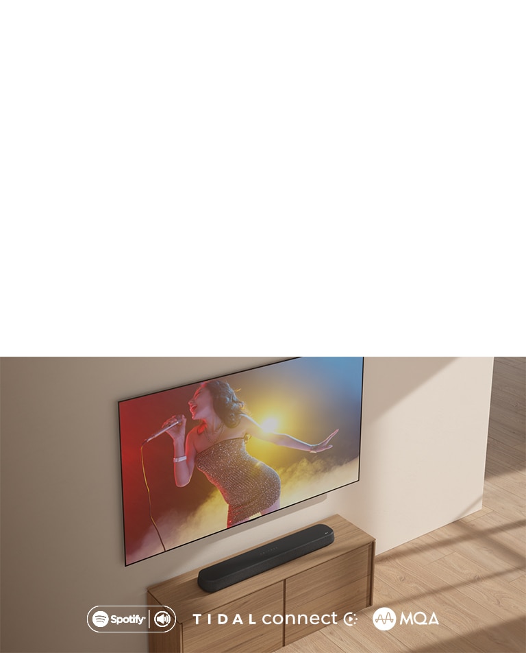 LG TV is hung on the wall. On the screen, a woman with mini dress is singing with a microphone in her right hand in red, yellow and blue lights. Soundbar  is placed right below.