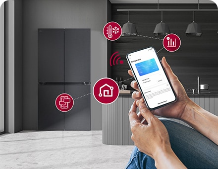 Smart phone is shown giving instructions to the fridge in background