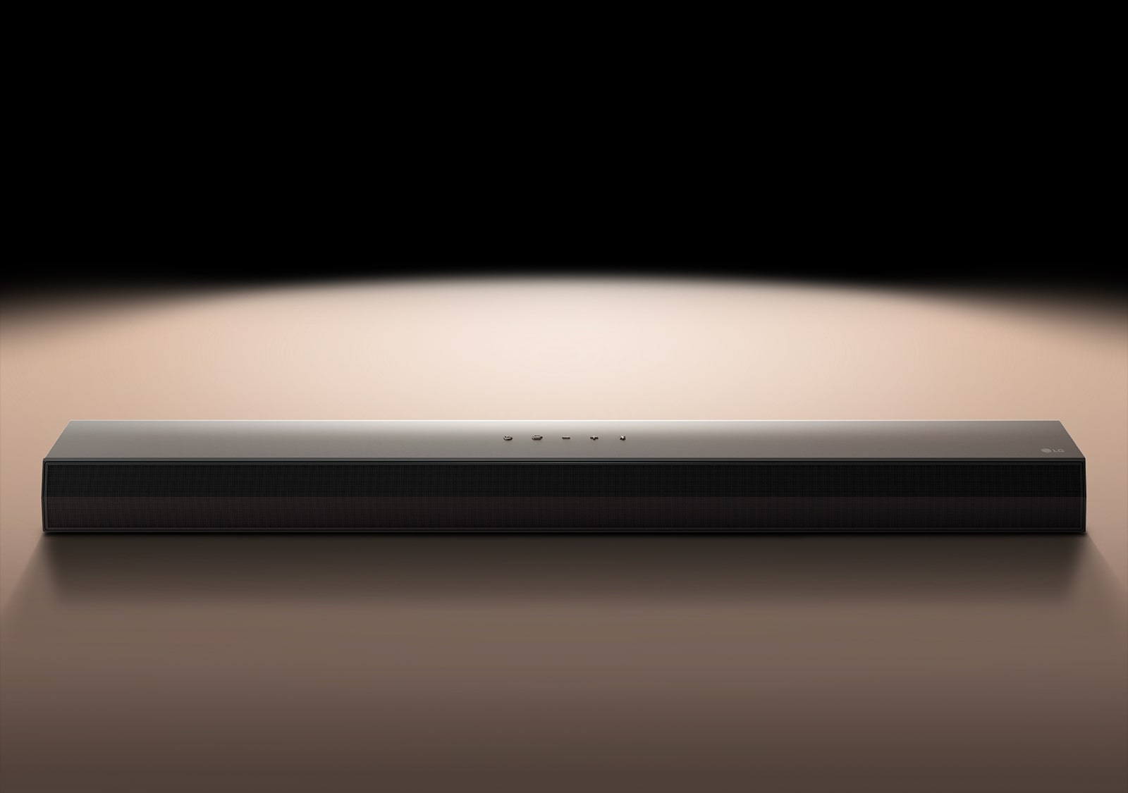 LG Soundbar against a black backdrop highlighted by a spotlight. 