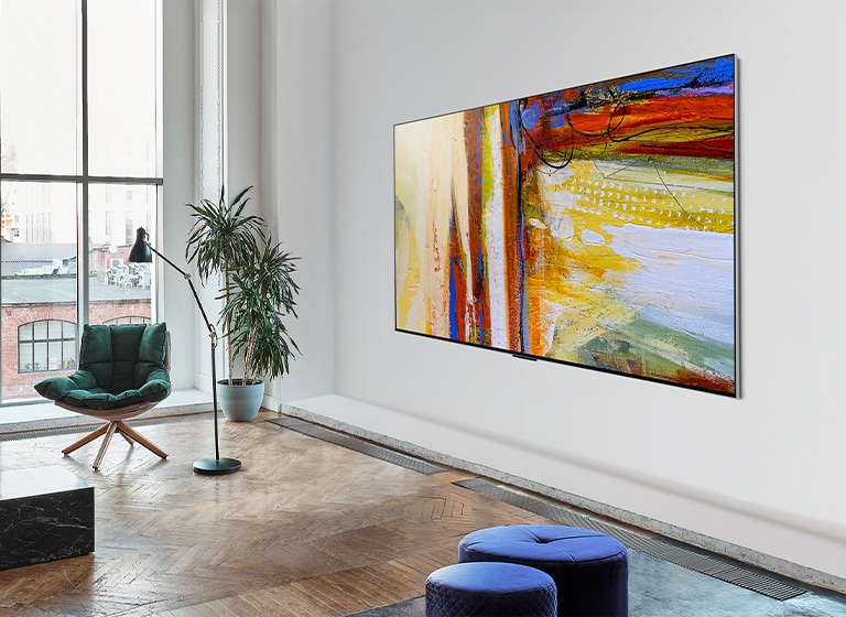 Imagem da LG OLED G3 exibindo uma colorida obra abstrata numa sala vívida e iluminada.