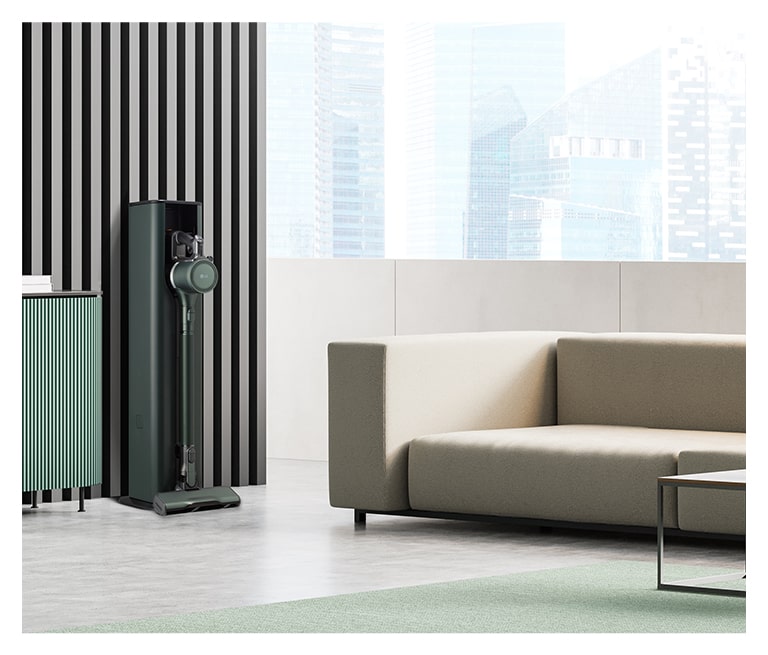 畫面顯示置於現代客廳的 LG Objet Collection A9TS 蒸氣無線吸塵機。