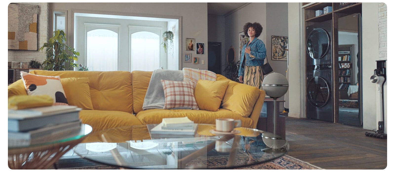 Woman standing in the living room satisfied with a healthy environment