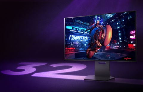 Na ekranie monitora Ultra Gear wyświetlany jest obraz z gry, a obok monitora widnieje liczba 32.