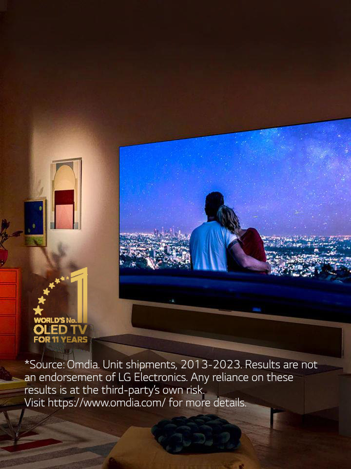 An image of LG OLED evo G3 on the wall of a modern and quirky New York City apartment with a romantic night scene playing on the screen.  11 Year World's No.1 OLED TV emblem. 