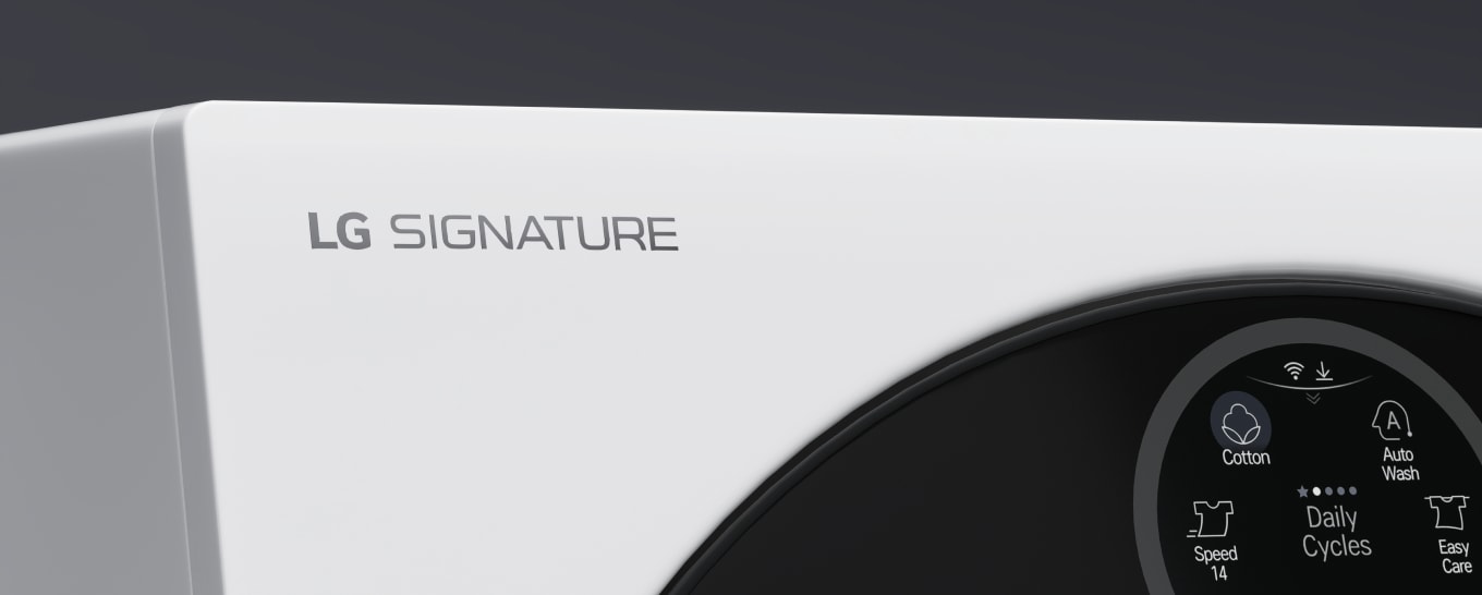 A close up image of the top left hand corner of the LG Signature Washing Machine, showing the top of the door and Quick Circle Display, and the LG Signature logo engraving.