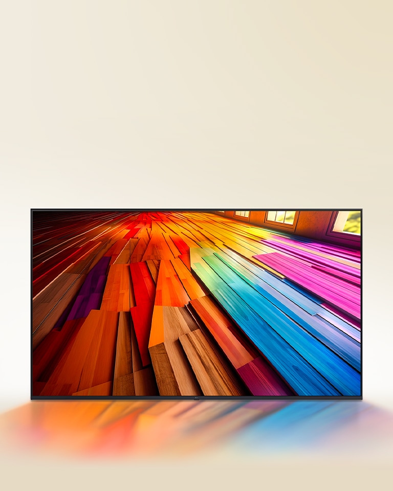 Ένα μεγάλο δάπεδο από σκληρό ξύλο με ζωηρά χρώματα εμφανίζεται σε μια LG UHD TV.