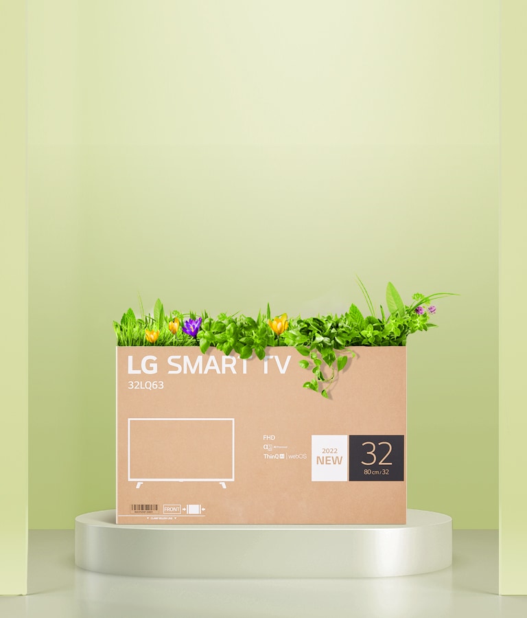 הקרטון הממוחזר המשמש כאריזה של מסך LG FHD מוצג וצומחים ממנו פרחים.