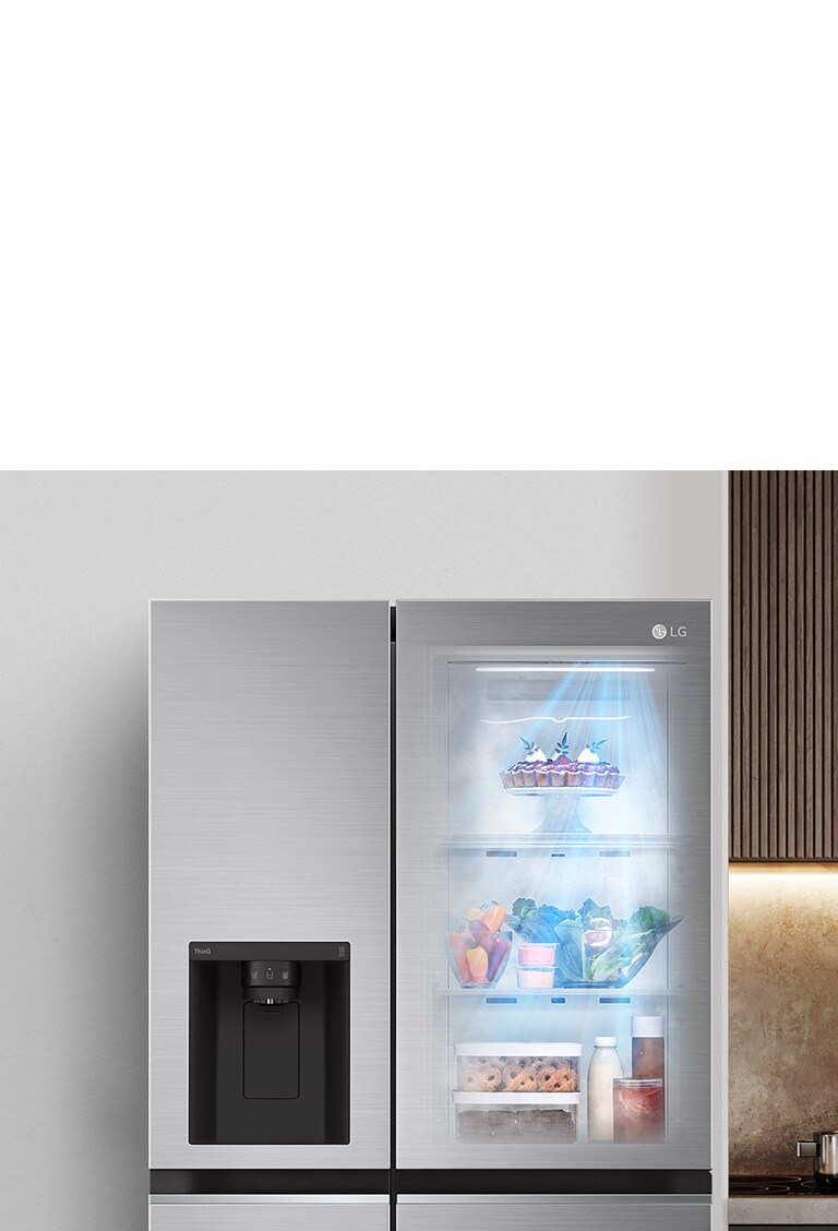 The front view of a black InstaView refrigerator with the light on inside. The contents of the refrigerator can be seen through the InstaView door. Blue rays of light shine down over the contents from the DoorCooling function. 