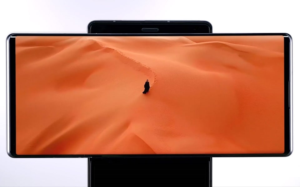 An image of a person in the desert on the main screen of the LG WING in swivel mode