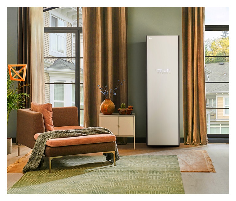 It shows mist beige color LG Styler Objet Collection placed in the dressing room that matches naturally to the furniture around.