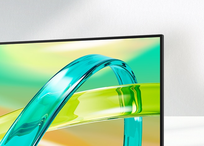 LG FHD monitor displays a green and yellow gradient background with a translucent curved object floating across the screen.