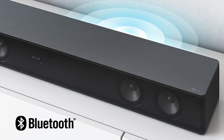 LG Sound Bar is on the white shelf. The Sound graphic coming out from the speaker. LG logo is shown on the right corner of the sound bar.