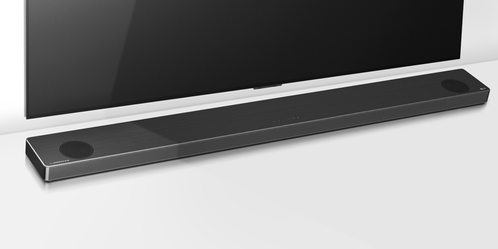 Full shot of TV with LG Soundbar slightly tilted right. CES 2020 Awards logo below sound bar.