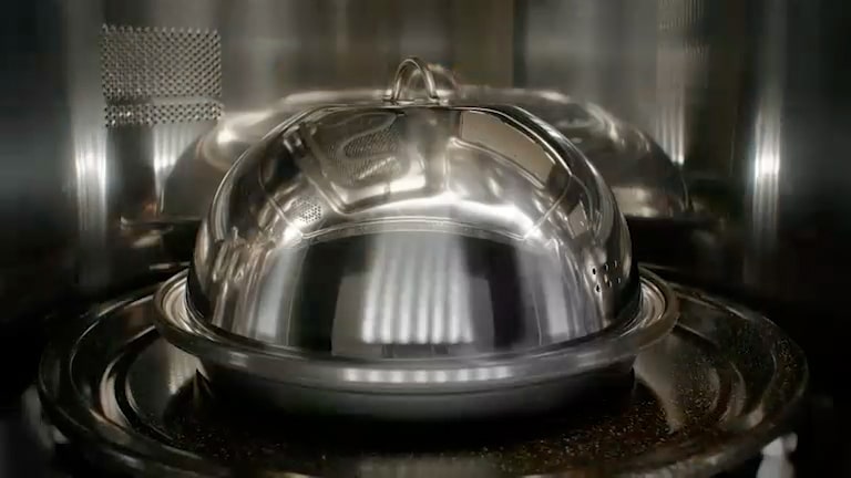 This image shows a reflective dome-shaped Steam Cover accessory placed inside SoalrDOM™.