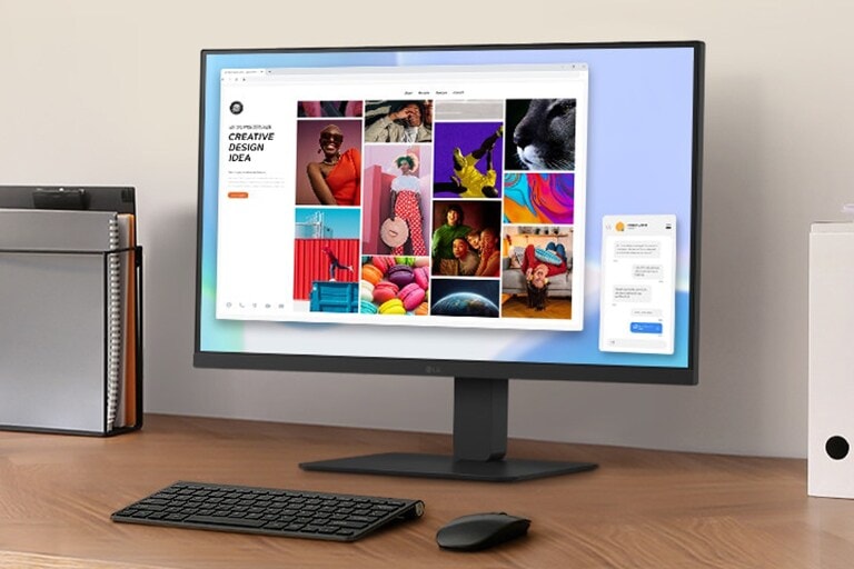 A workspace on a desk with a monitor and document holder.	