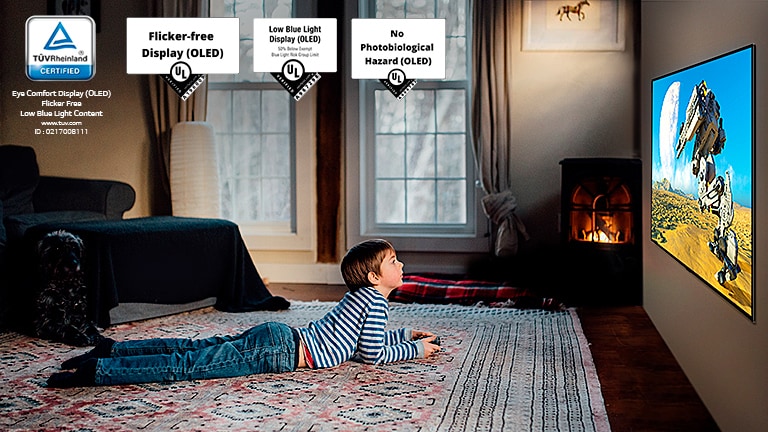 Child sitting on the floor, holding a joystick and playing a game on a TV screen
