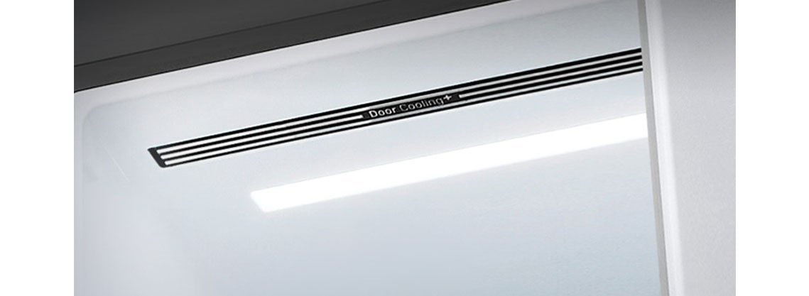 A diagonal view up into the top of the refrigerator showing the soft LED lighting.