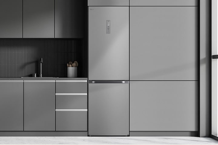 Modern kitchen with a refrigerator that blends seamlessly into surrounding cabinetry, resembling a built-in model.