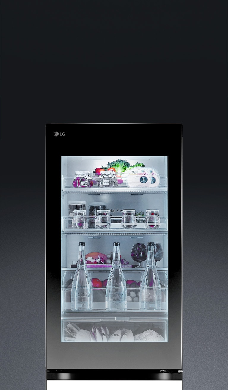 The lg refrigerator door is knocked on twice, and the insta view light turns on, revealing the food items inside without opening the door.