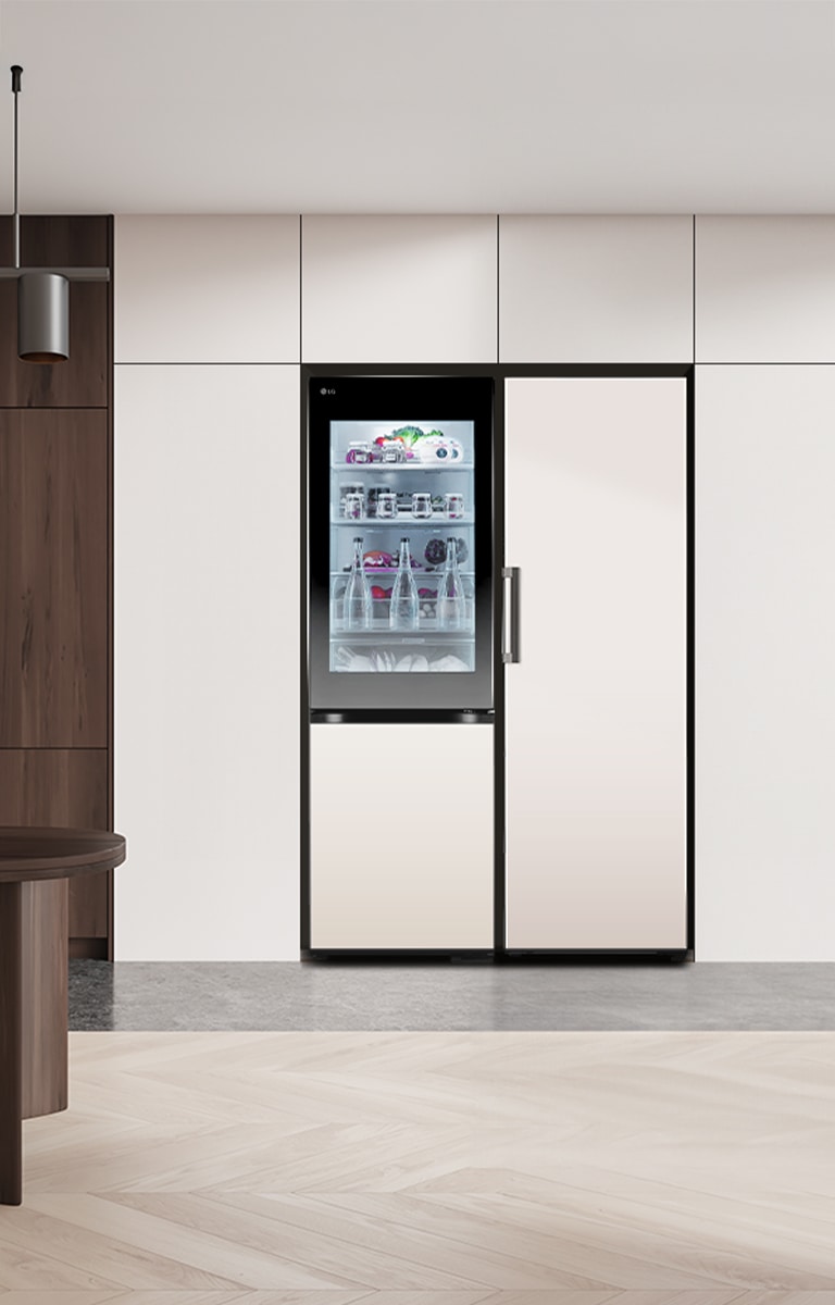 LG bottom freezer with instaview feature installed in a modern kitchen with lg larder objet collection.