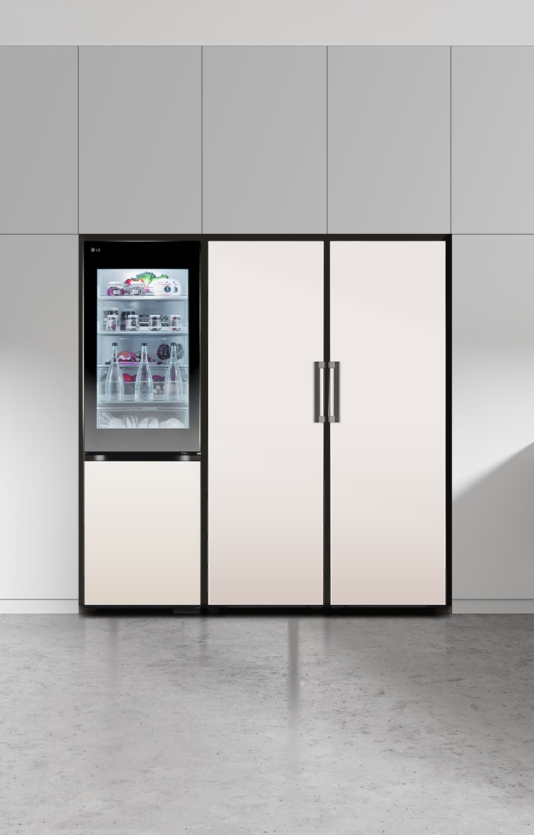 LG bottom freezer with instaview feature installed in a modern kitchen with lg larder objet collection.