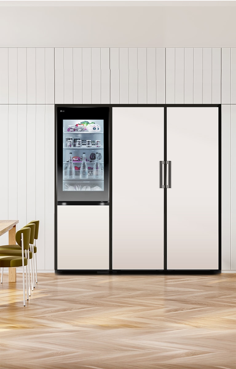 LG bottom freezer with instaview feature installed in a modern kitchen with lg larder objet collection.