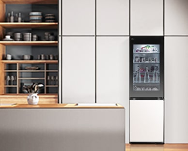 lg bottom freezer with instaview in a blue modern kitchen.