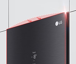 The top of the freezer is shown at an angle with two arrows pointing in toward the wall to indicate it is flush with the cabinets surrounding it.