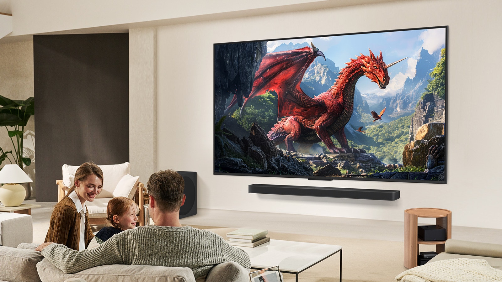 A family sits on a couch facing a LG QNED TV mounted on a wall above a LG Soundbar with a little girl pointing to a screen depicting two dolphins. 