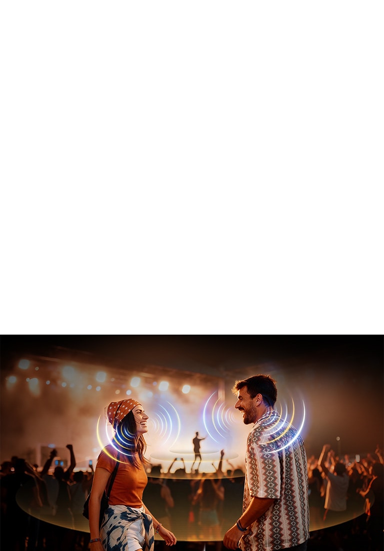 LG Micro RGB evo AI MRGB95 with AI Object Remastering Ultra shows two people facing each other at a crowded concert, clarifying voices amid loud background noise and delivering crystal-clear, immersive audio.