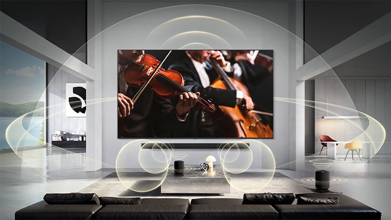 LG Micro RGB evo AI MRGB95 with WOW Orchestra displays a concert scene with a soundbar below the screen, while graphic sound waves extend across the living room to convey synchronized, surround sound. 