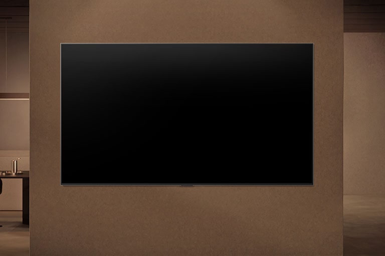 LG NANO 4K UHD AI NU85 is wall-mounted with the screen off, then turns on as a person approaches, using motion sensors to display an abstract swirling artwork.