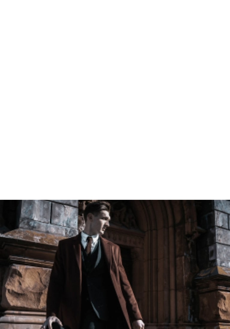 LG OLED evo AI C6 with AI Picture Pro shows a man in formal clothing beside arched stone architecture, as the alpha 11 AI Processor upscales the image to 4K, enhancing texture, depth, and contrast across the scene.