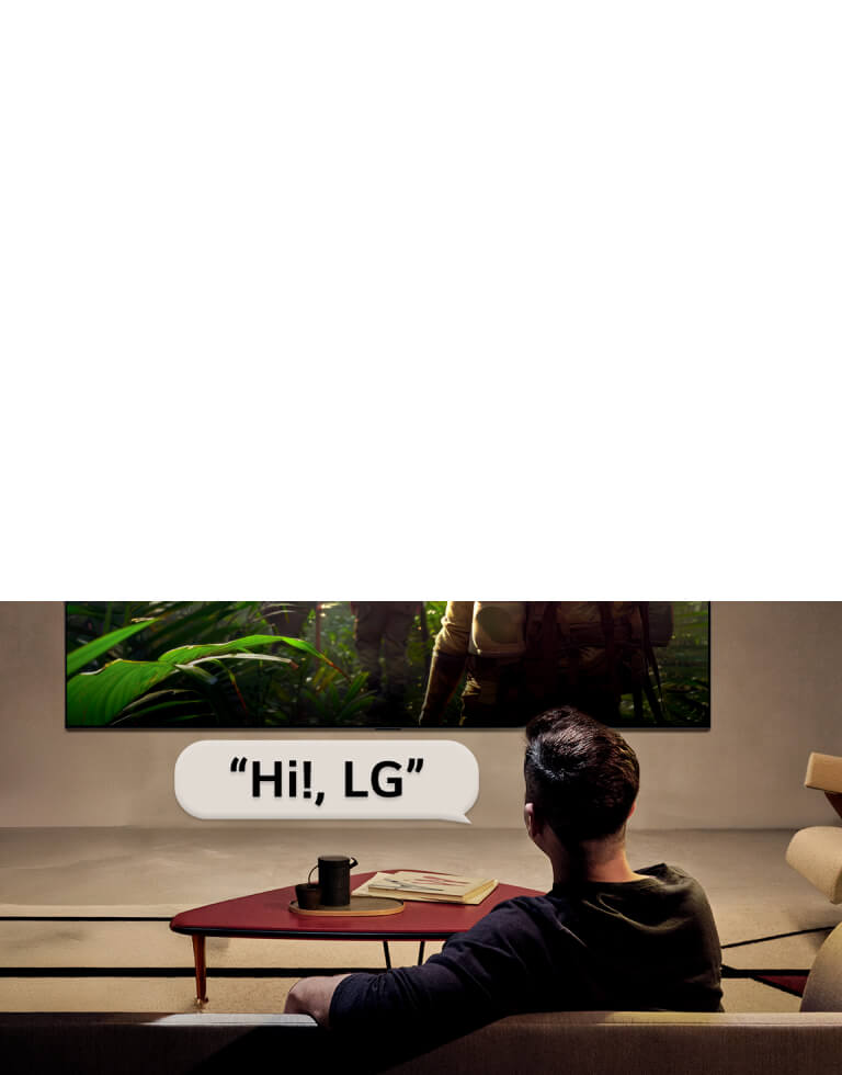 LG OLED evo AI C6 with Far Field Voice Recognition is activated through a voice command as a person seated in a room says “Hi, LG” toward the TV, indicating hands-free voice interaction within the TV interface.
