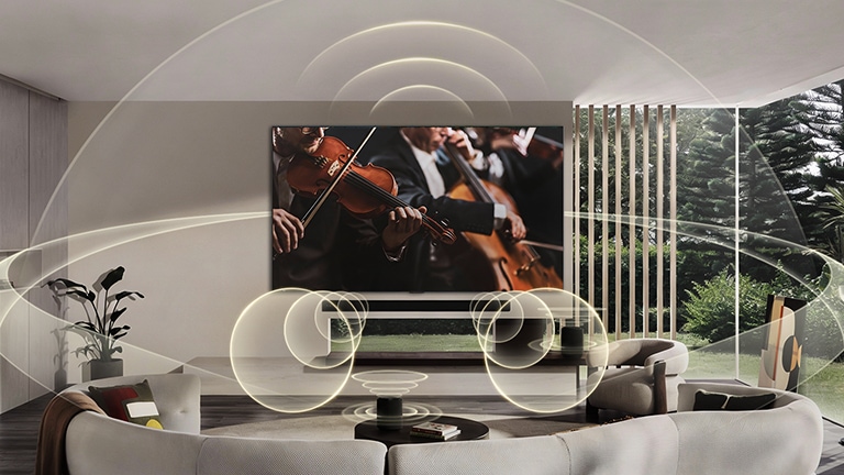 LG OLED evo AI C6 with WOW Orchestra and WOWCAST displays a concert scene with a soundbar below the screen, while graphic sound waves extend across the living room to convey synchronized, wireless surround sound.
