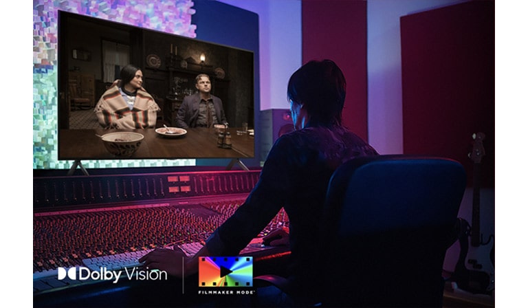 A director in front of a control panel editing the movie "Killers of the Flower Moon" on an LG QNED TV. In the bottom left, the Dolby Vision logo and FILMMAKER MODE logo.
