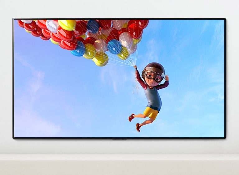 A scene of an animation showing a child hanging from colorful balloons in the sky shown on a TV screen