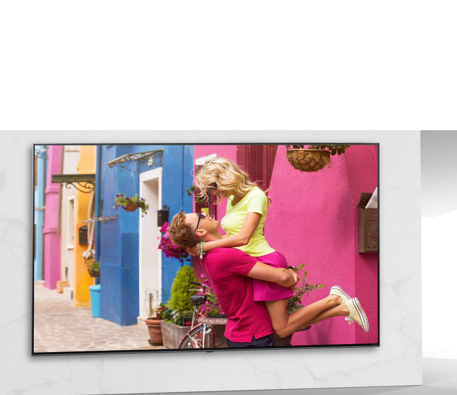 TV screen showing the scene of colorful romance movie with men and women hugging.