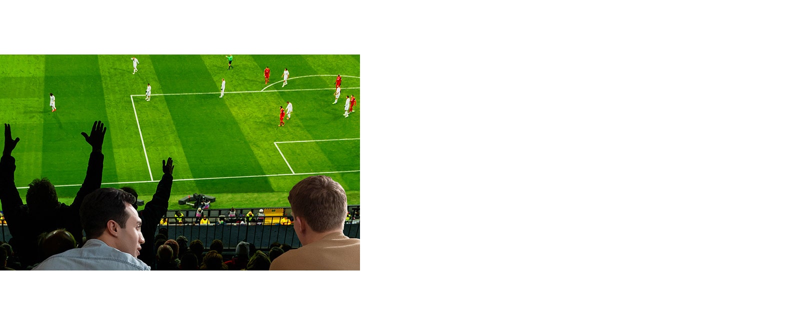 People watching sports game on TV in the living room with ultra large scree TV