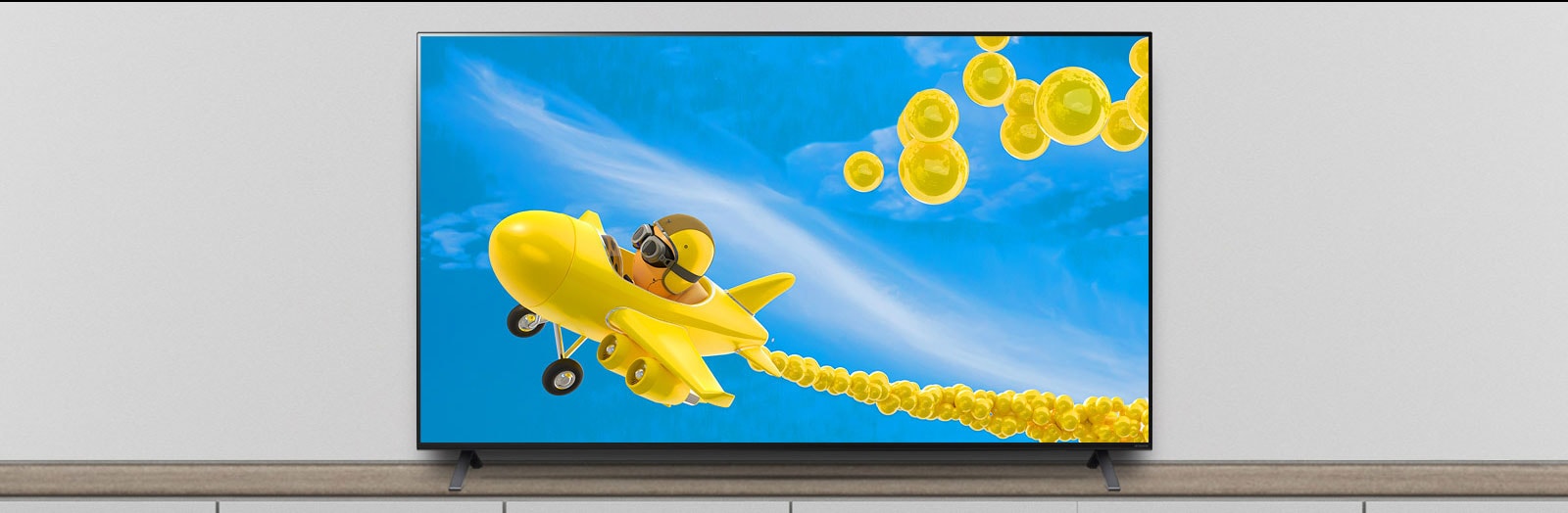 The TV is on the stand, and the screen shows an animation of an airplane flying through it.