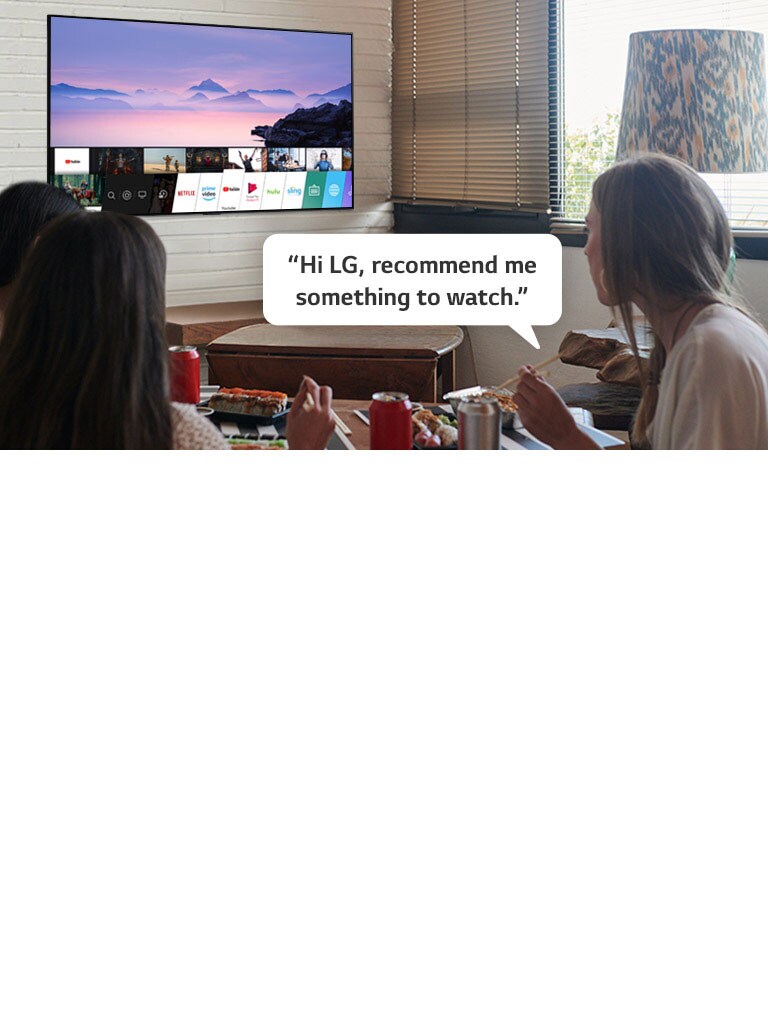 Three woman eating sushi while one of them asks LG TV recommendations to watch