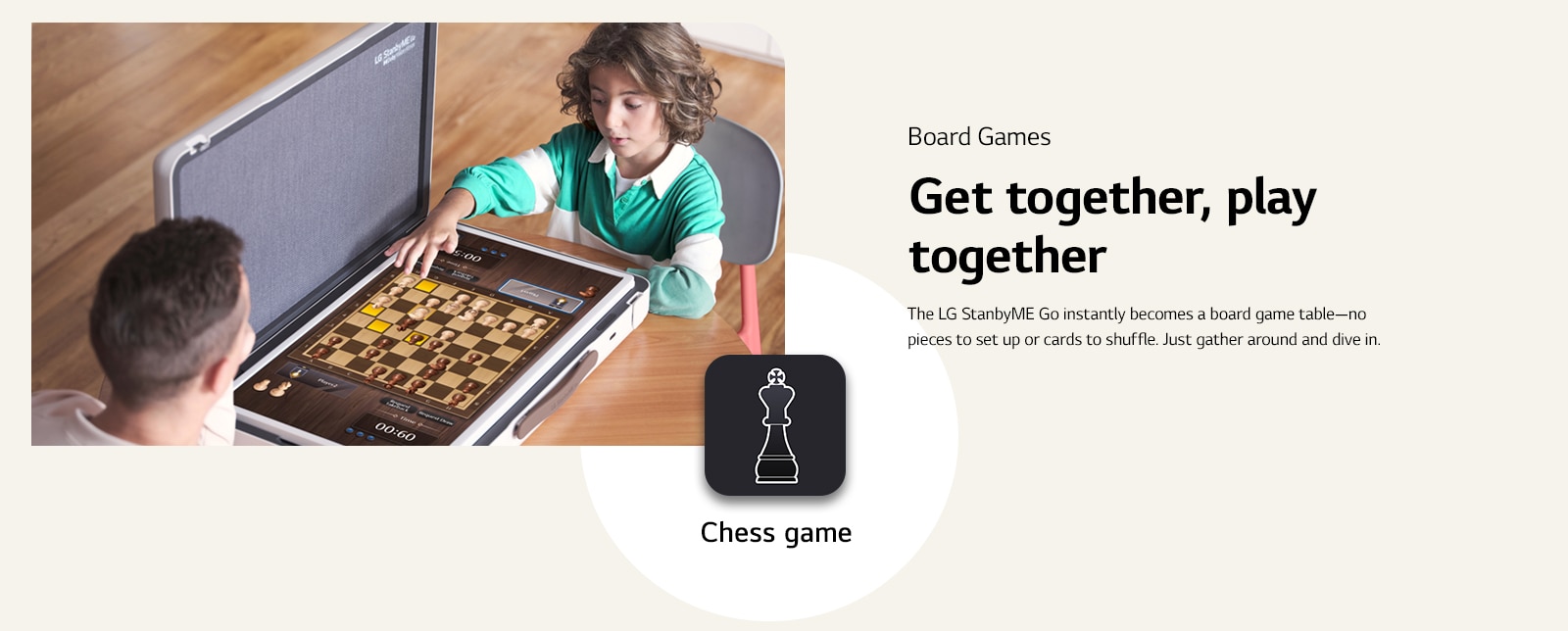 Father and son plays chess game through the LG StanbyME Go. In the middle of the image, Chess game icon is shown.