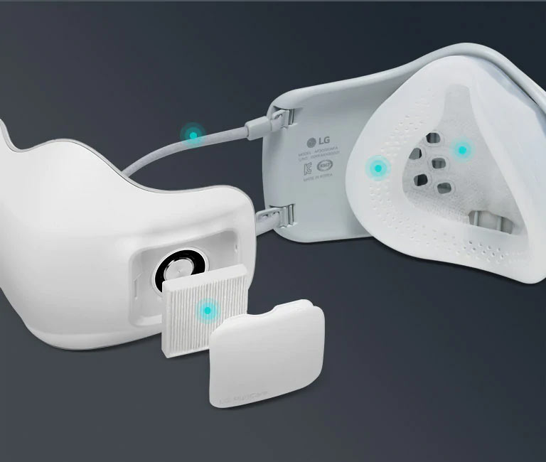 The first image shows the exterior of the face Wearable Air Purifier with the filter and cap exposed. A blue dot on the filter indicates this is disposable and can be replaced. The second image shows the interior of the Wearable Air Purifier and blue dots on the face pad and Wearable Air Purifier ear straps indicate they are washable.