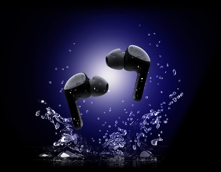 A pair of earbuds is floating on a background with water drops.