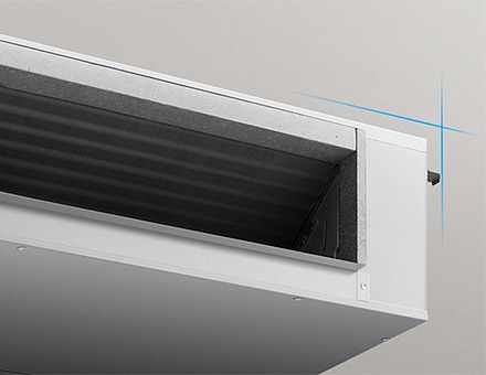 Close-up of a ducted unit air outlet, showing internal airflow fins and a compact rectangular housing.