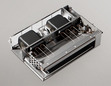 Internal view of static ducted unit showing dual fans, motor, and copper coil layout.