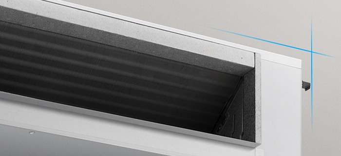 Close-up of a ducted unit air outlet, showing internal airflow fins and a compact rectangular housing.