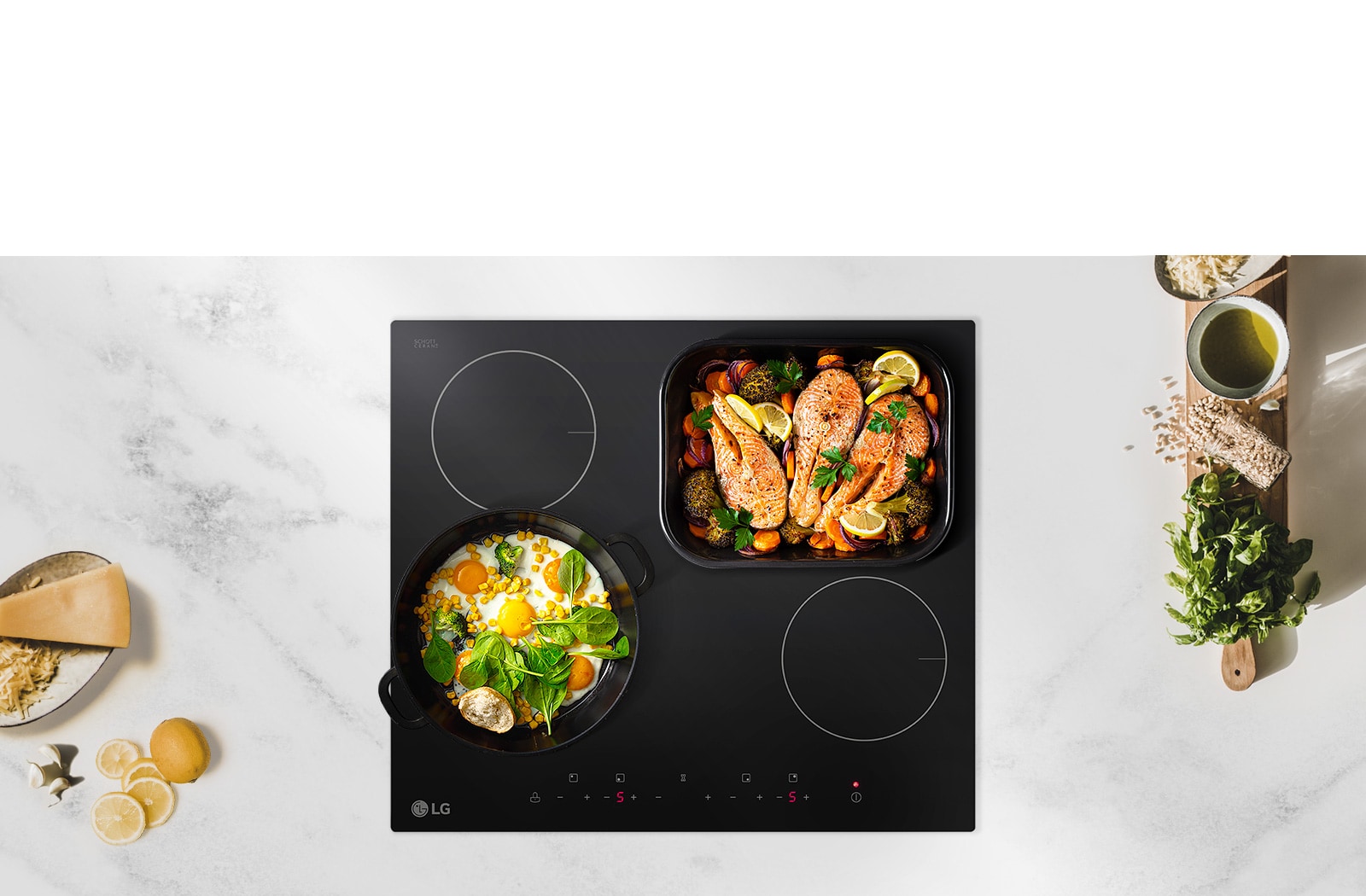 The cooktop is seen from above. Two burners have pans of food on top.