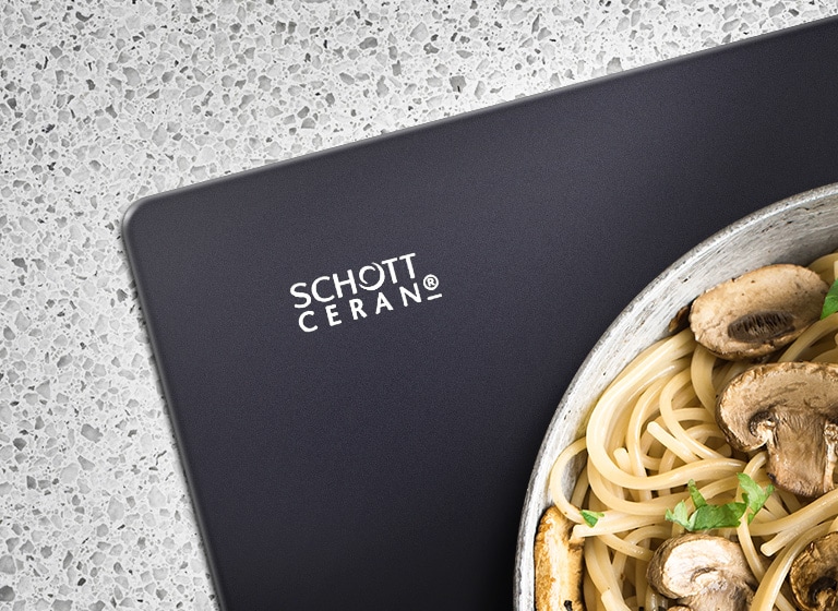 The corner of the cooktop is shown with the SCHOTT Ceran logo shown.